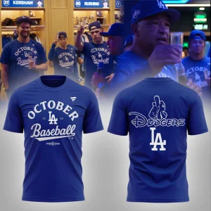 Front and back view of the LA Dodgers October Baseball 2025 shirt with players celebrating in the background wearing the gear.