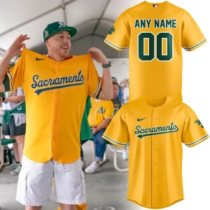 Man wearing the yellow Oakland A's Sacramento jersey, shown alongside the customizable front and back product mockups.