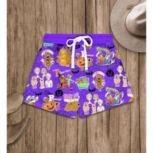A detailed view of the purple Scooby-Doo Halloween pajama shorts featuring an all-over print of the gang, monsters, and snacks.