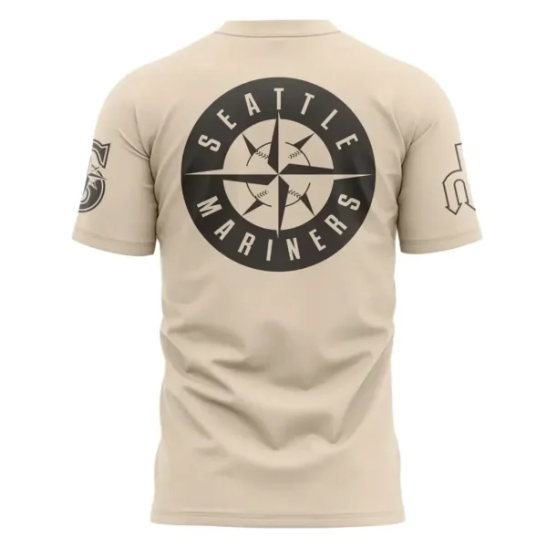 The back of the tan t-shirt featuring the black Seattle Mariners compass logo printed in the center.