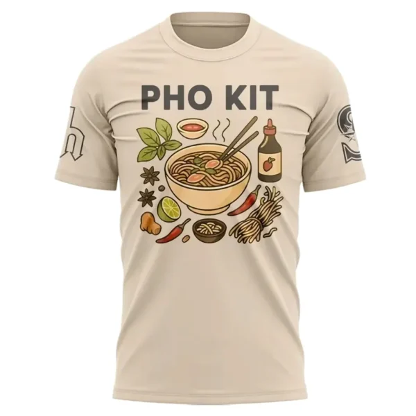 The front of a tan t-shirt with the text "PHO KIT" above a colorful graphic of a bowl of pho and its ingredients.