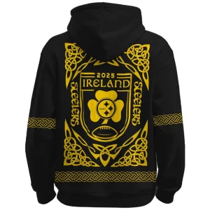 Back of the black Steelers hoodie featuring a large yellow Celtic-inspired crest with "2025 Ireland" and the Steelers logo.
