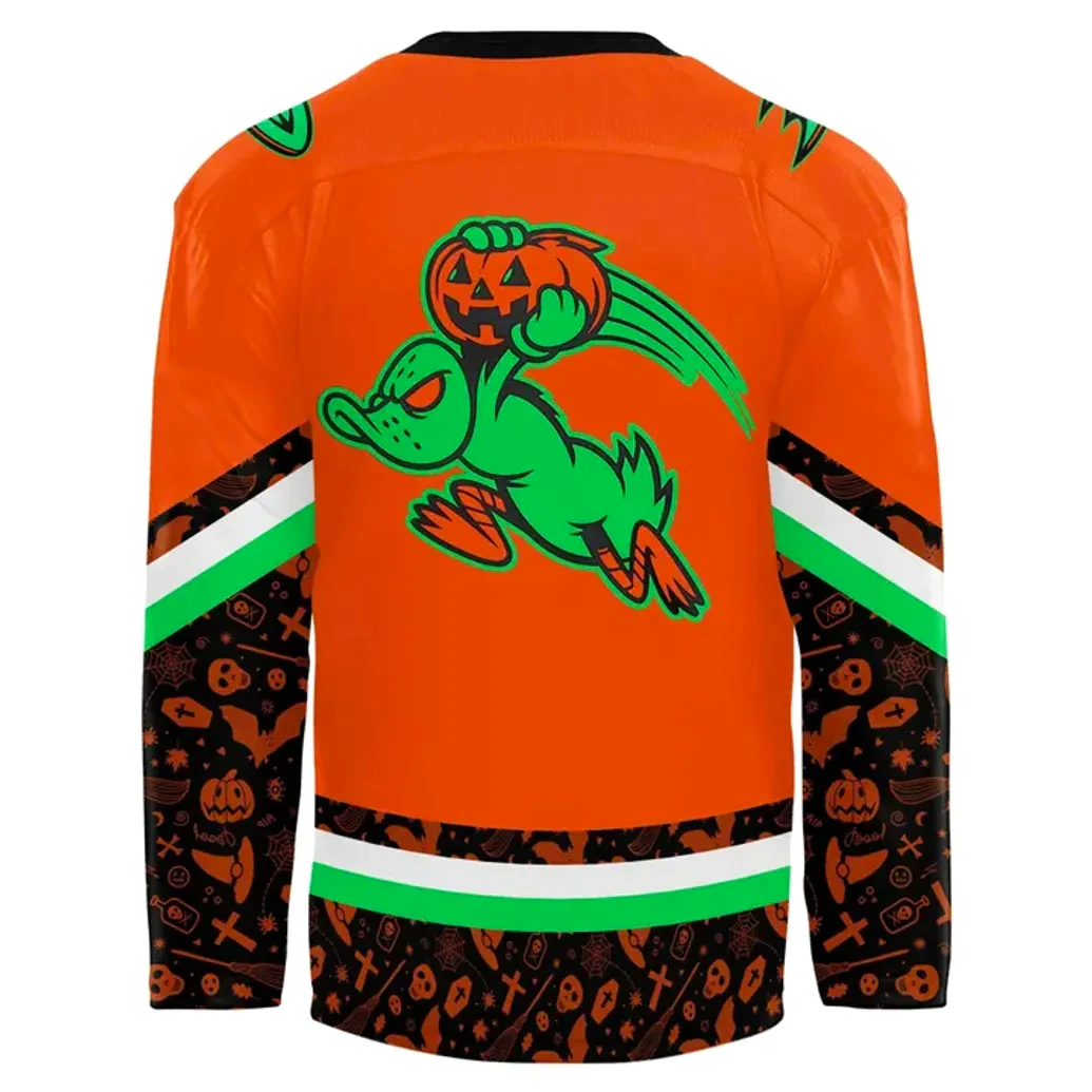 Back View Of The Anaheim Ducks 2025 Halloween Jersey Close-up of the back of the orange Anaheim Ducks Halloween jersey, with a graphic of a duck flying with a pumpkin.