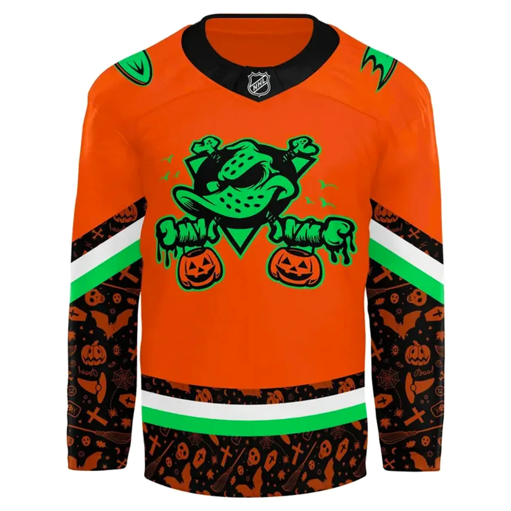 Front View Of The Anaheim Ducks 2025 Halloween Jersey Close-up of the front of the orange Anaheim Ducks Halloween jersey, featuring the spooky Wild Wing crest.