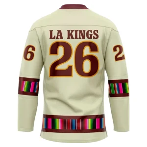Back of the LA Kings Mexican Heritage jersey displaying 'LA KINGS' and the number 26 with serape-inspired stripes.