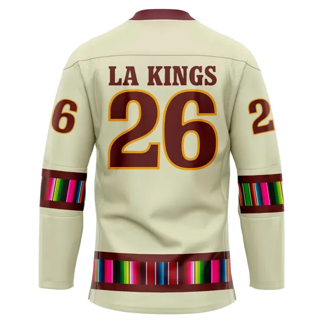 Back View Of The La Kings 2025 Mexican Heritage Hockey Jersey Back of the LA Kings Mexican Heritage jersey displaying 'LA KINGS' and the number 26 with serape-inspired stripes.