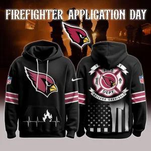 Front and back views of a black Arizona Cardinals firefighter hoodie featuring the Cardinals logo on the chest, heartbeat flame graphic on the pocket, maroon sleeve stripes and a firefighter department crest over a distressed American flag on the back.