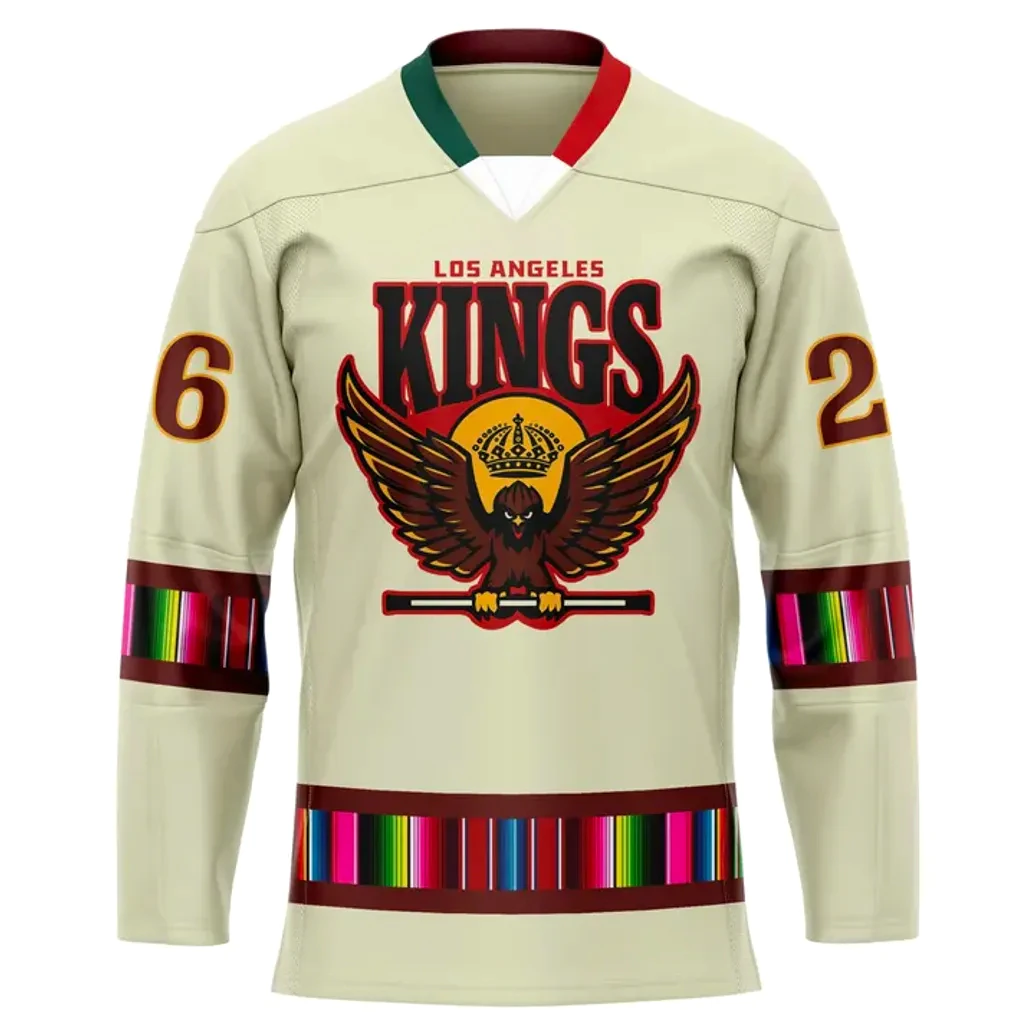 Front View Of The La Kings 2025 Mexican Heritage Hockey Jersey Front of the LA Kings Mexican Heritage jersey showing the eagle crest, serape-style stripes on the sleeves, and number 26.