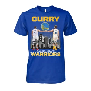 A royal blue Golden State Warriors T-shirt featuring a 3D graphic of Stephen and Seth Curry fist bumping over the SF skyline.