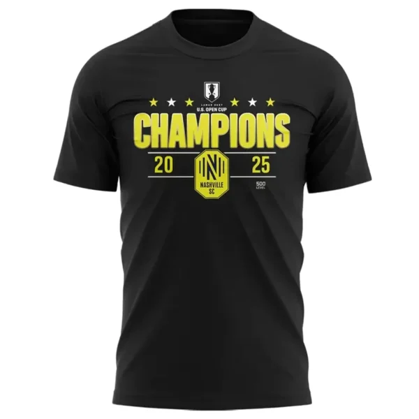 A close-up of the front of the black Nashville SC t-shirt with the yellow "Champions 2025 U.S. Open Cup" graphic.