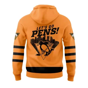 A back view of the gold Pittsburgh Penguins hoodie, featuring "LET'S GO PENS!" text over a Pittsburgh skyline graphic.