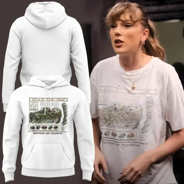 A white pullover hoodie with a front pocket, showcasing the vintage Monterey Bay Aquarium sea otter graphic.