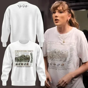 Front and back view of a white long-sleeve sweatshirt featuring the Monterey Bay Aquarium sea otter design.